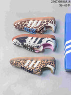 Top-down view showing three Adidas Samba OG animal-print colorways, including leopard, cow print and brown-and-cream patterns.