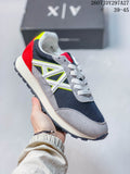 Gray, black, white, red, and neon-accent low-top sneaker with a prominent side logo.