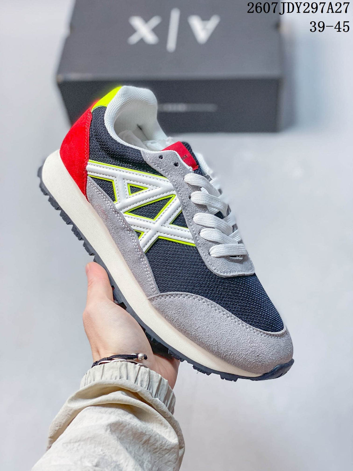 Gray, black, white, red, and neon-accent low-top sneaker with a prominent side logo.
