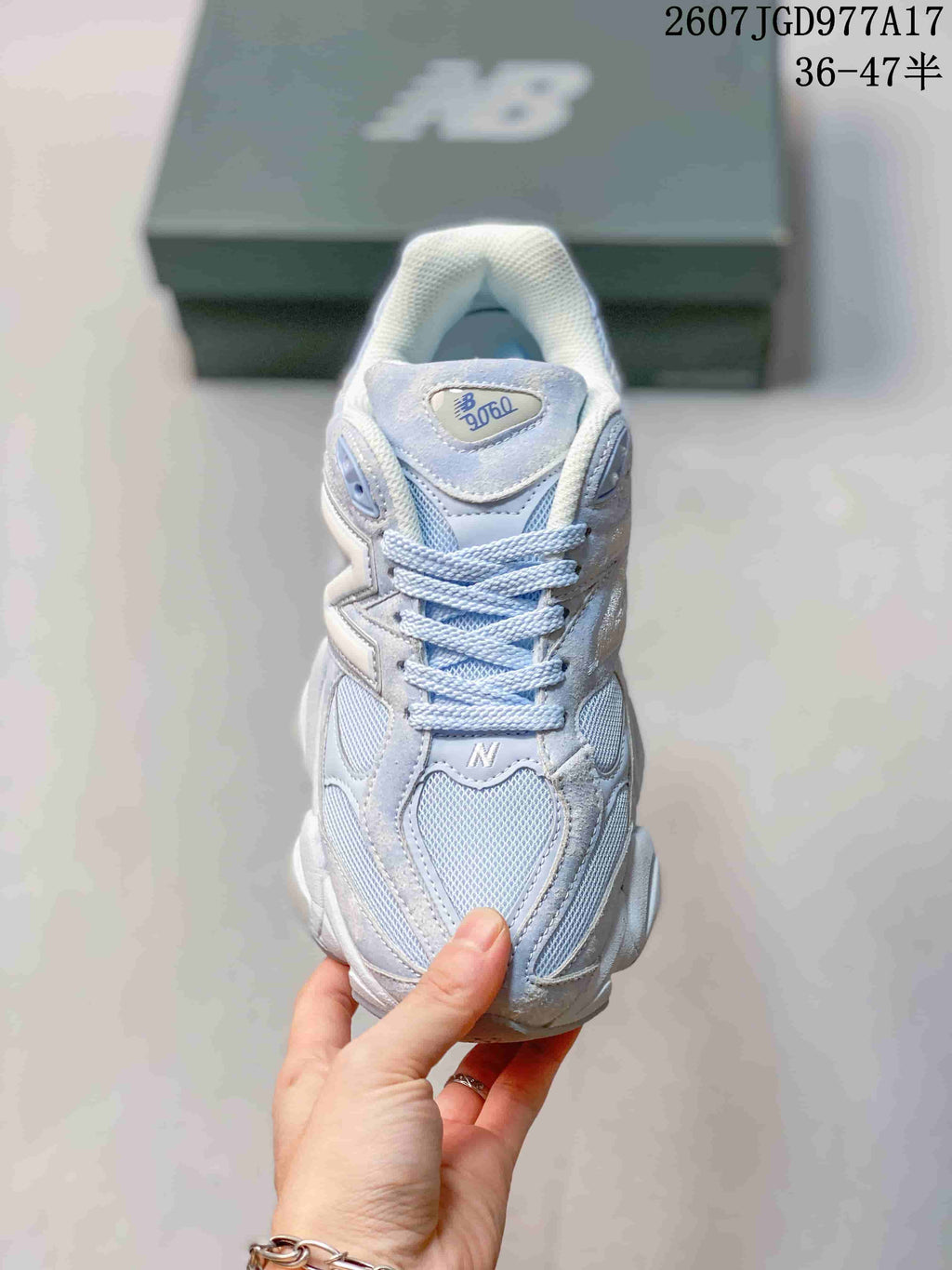 Top view of the New Balance 9060 sneaker showing the mesh toe box, tonal laces, and tongue branding.