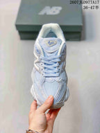 Top view of the New Balance 9060 sneaker showing the mesh toe box, tonal laces, and tongue branding.