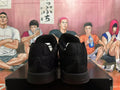 Rear view of a pair of black Nike basketball shoes on a box