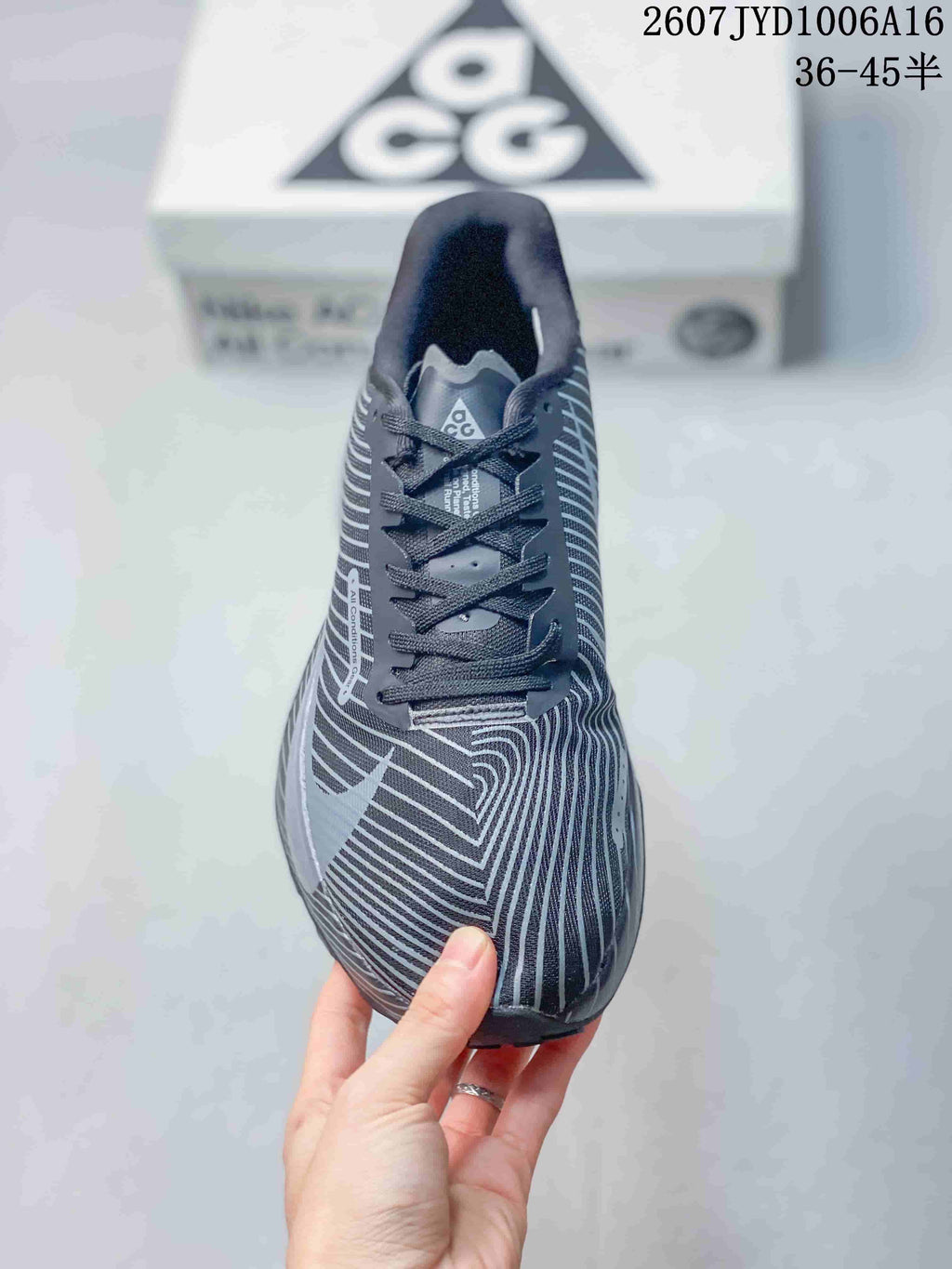 Top view showing the lace-up closure, striped toe box, and ACG tongue branding.