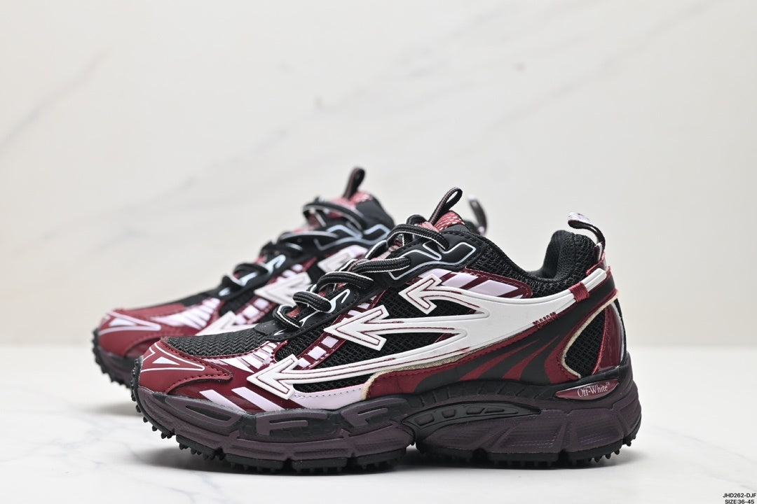 Side view of the burgundy, black, and white sneakers showing layered white side graphics, black mesh panels, and chunky midsoles.
