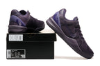 Dark purple Kobe 8 Protro shoes displayed with a shoe box.