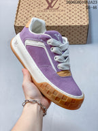 Angled side view highlighting the purple upper, white trim, and gum-colored outsole.