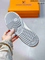 Close-up of the grey patterned outsole and orange shoebox
