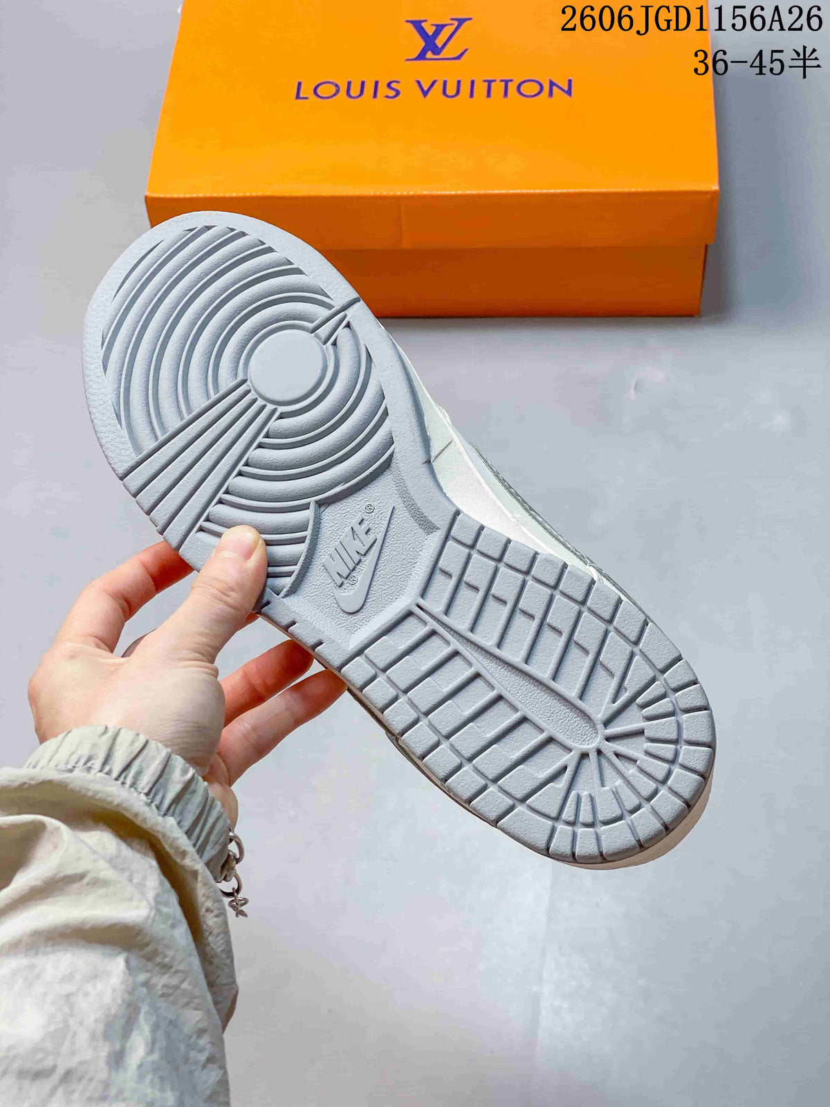 Close-up of the grey patterned outsole and orange shoebox