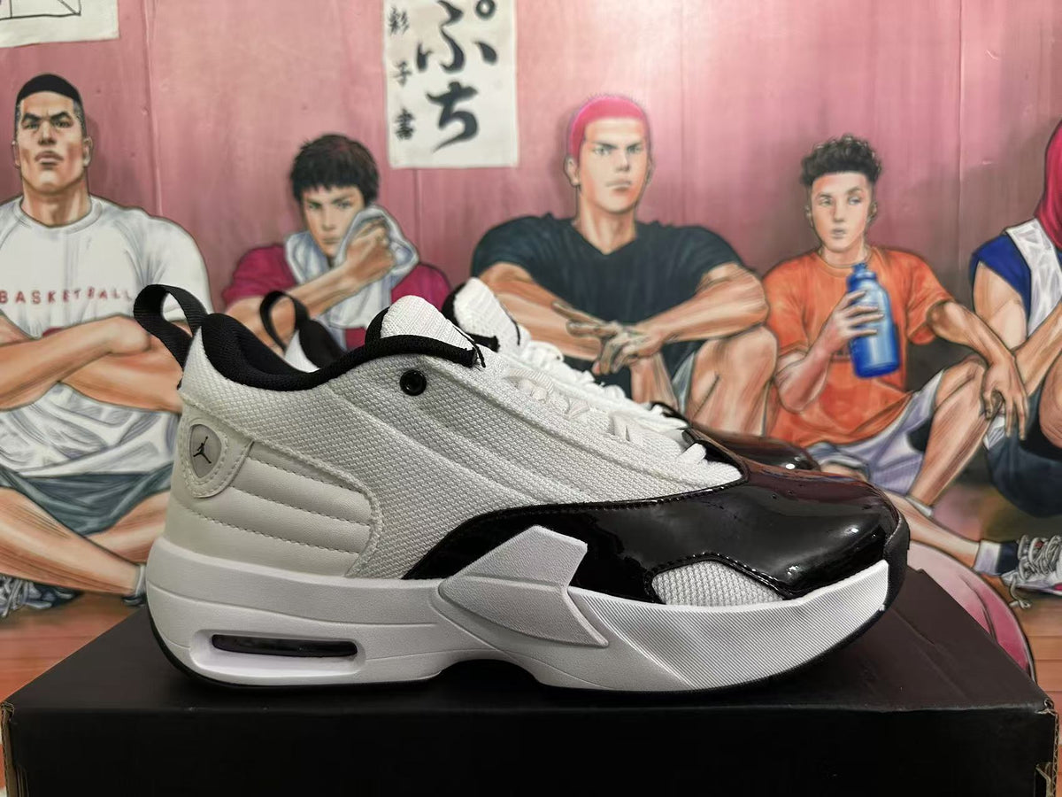 Side profile of a white and black Jordan sneaker showing the textured upper, glossy black forefoot panel, layered sole, and visible air-cushion window.