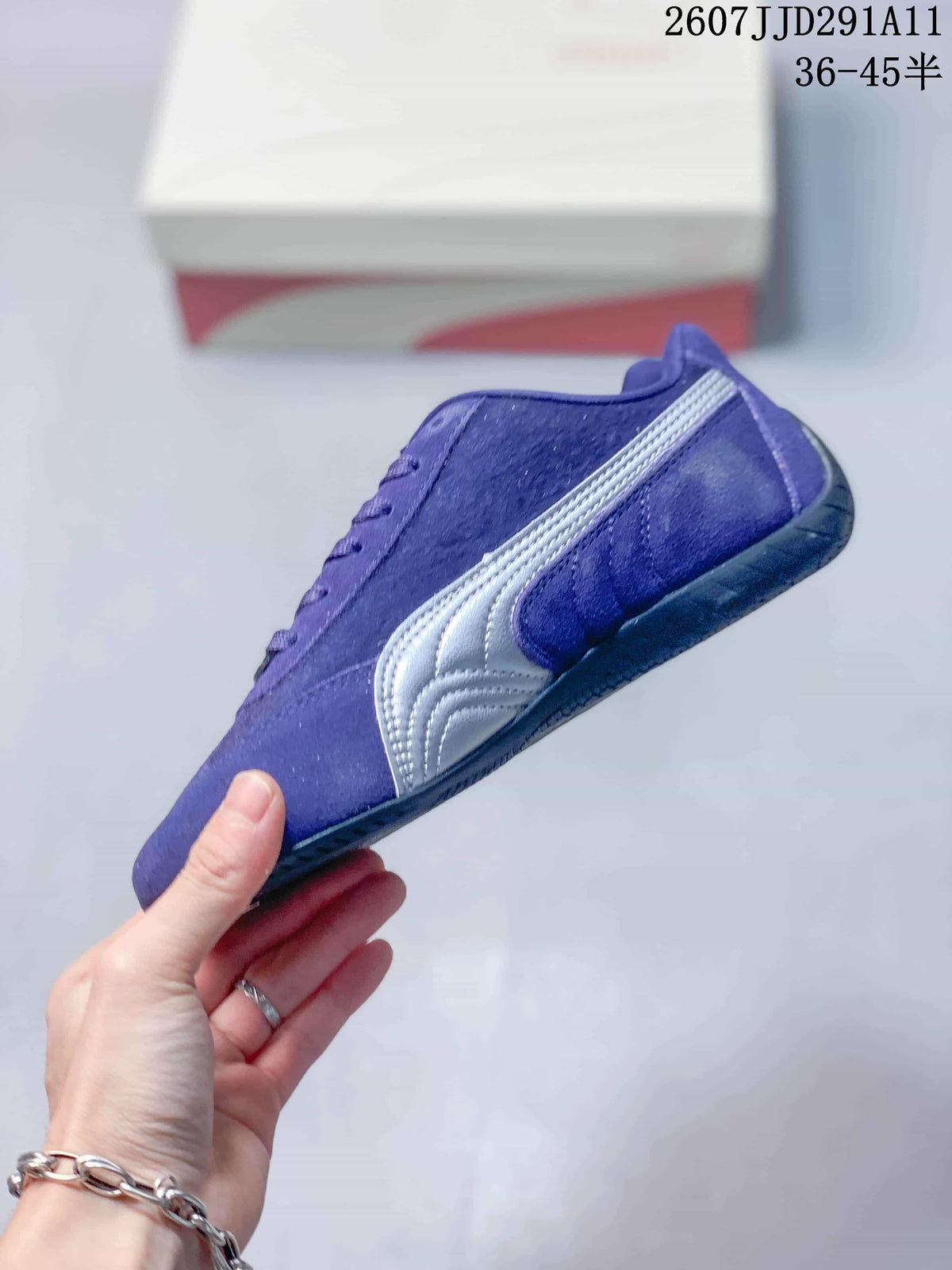 Side view of the purple sneaker showing the silver Puma side stripe and low-profile sole.