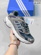 Gray adidas Response CL sneaker with darker mesh panels, silver-toned side stripes, and a white sole.