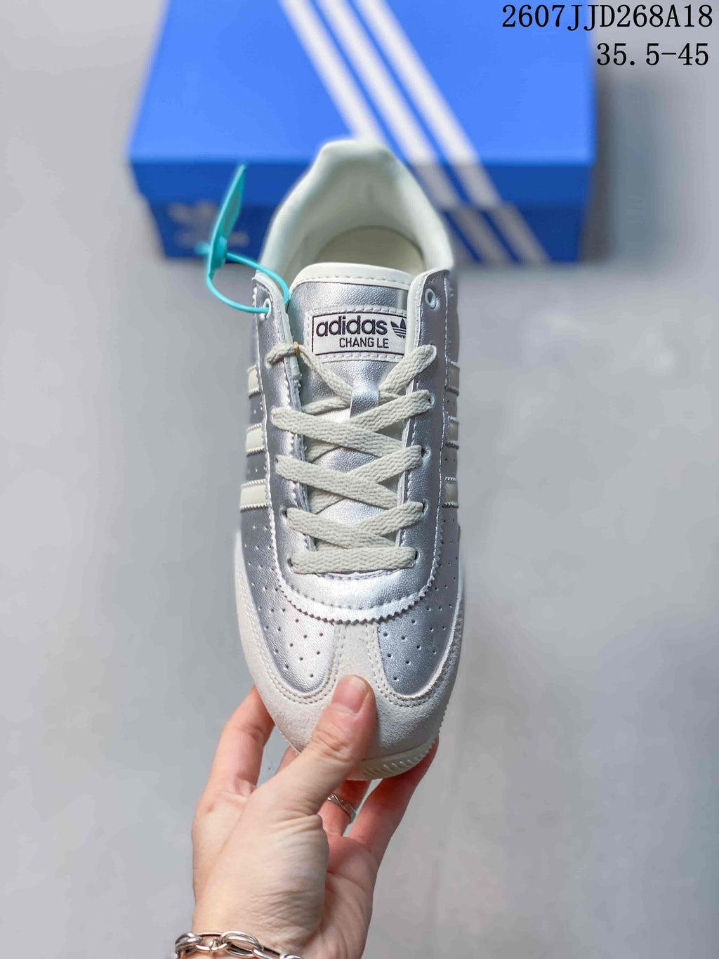 Top view of the sneaker showing the perforated toe, white laces, padded tongue, and contrast panels.