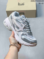 Angled side view of the silver and white Trispeed 3000 Trainer
