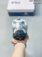 Rear view of the sneaker showing the padded heel, FILA branding and black outsole.