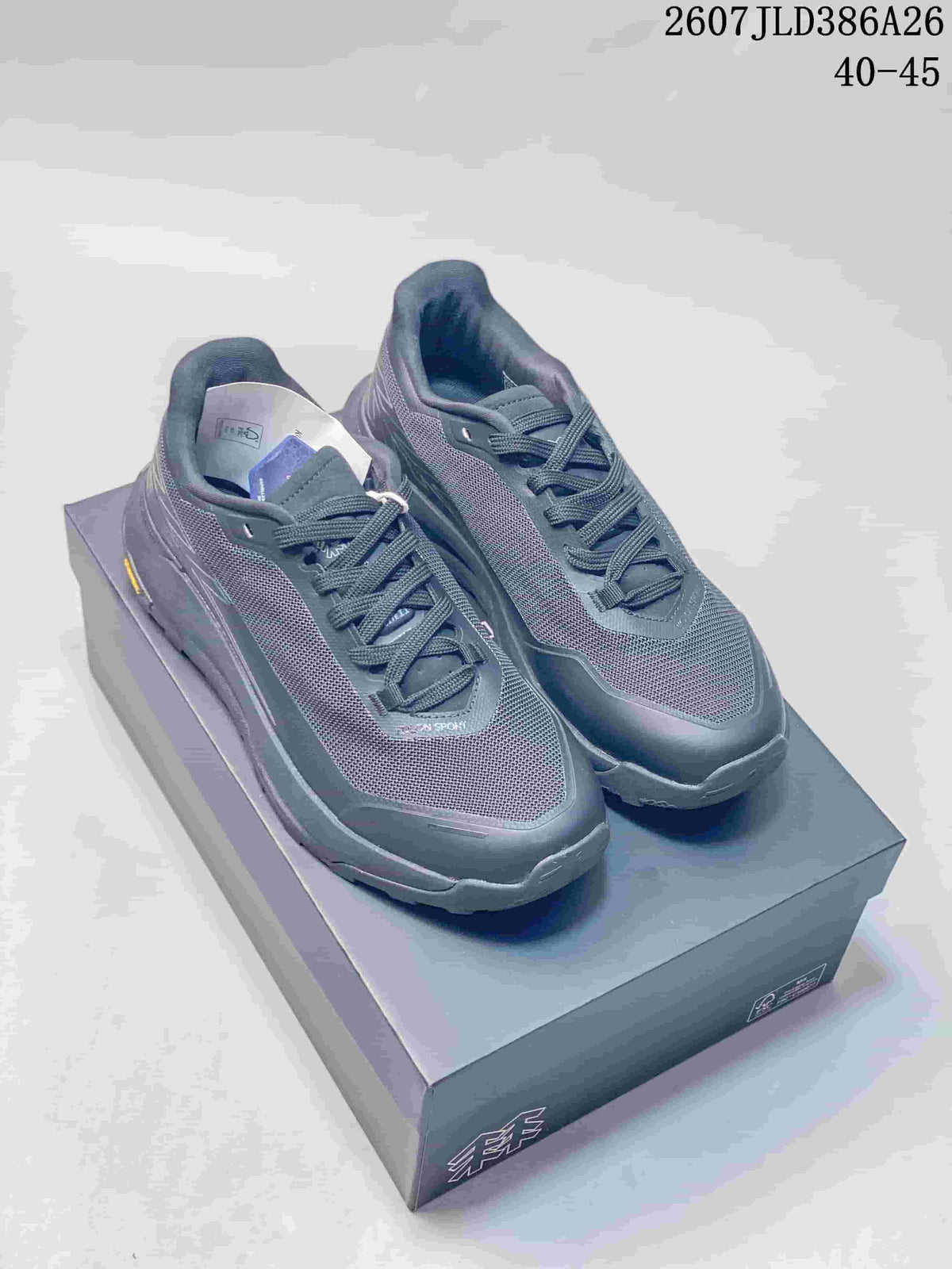 Pair of dark gray and black KOLON SPORT EGG LITE 2.0 hiking shoes displayed on their box.