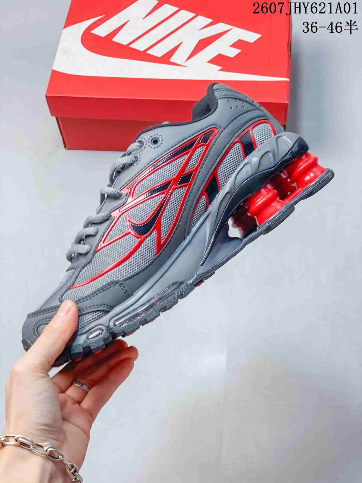 Side view of the grey and red Nike Shox Ride 2 sneaker