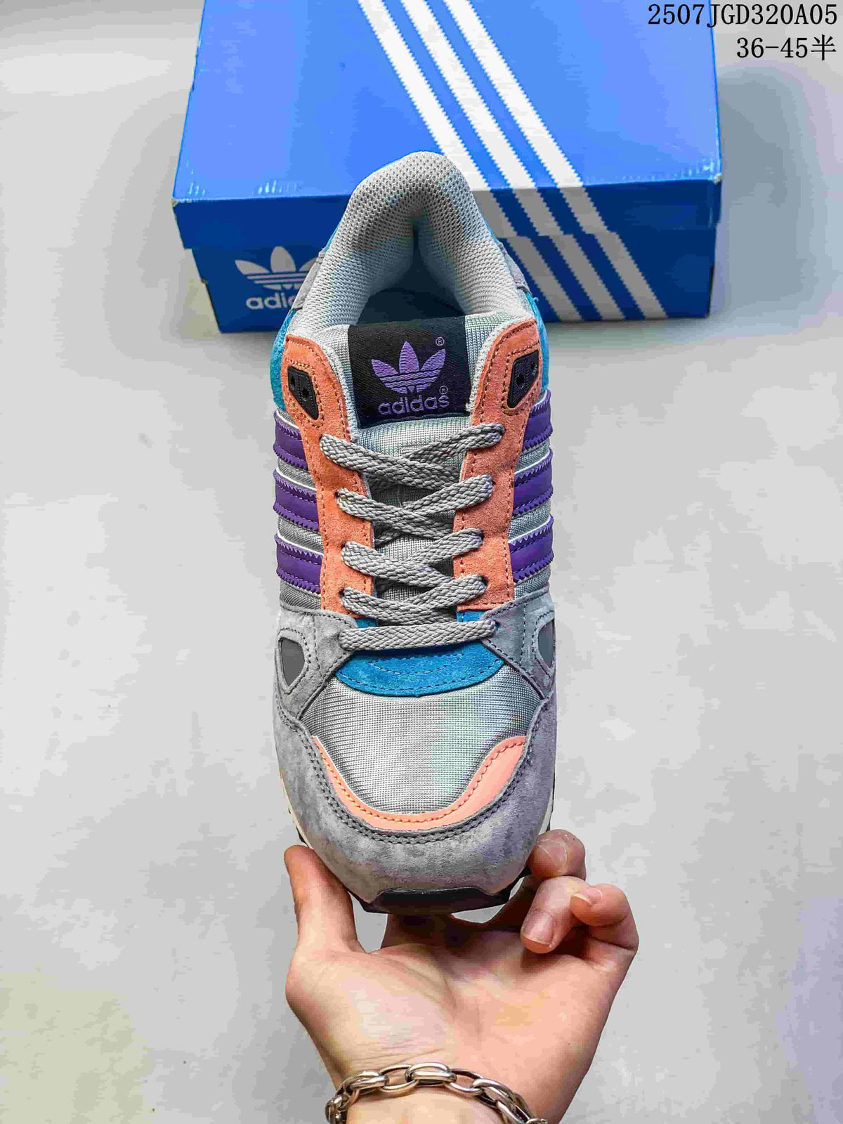 Top view of an adidas ZX 750 sneaker showing its laces and multicolor panels.