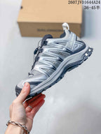 Side view of a silver and gray Salomon XA Pro 3D Seasonal sneaker with mesh panels, overlays, and a lugged outsole.