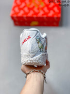 Rear view showing Ja branding, illustrated graphics and the textured heel area.