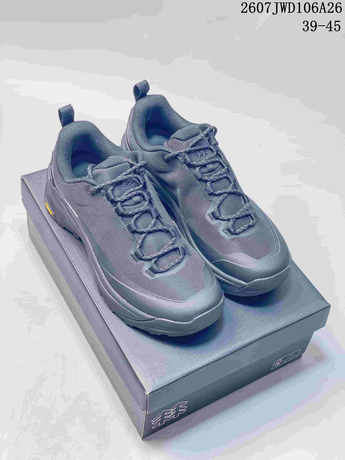 Pair of dark gray KOLON SPORT hiking shoes displayed on a shoebox, with the source-listed code and size range visible above.