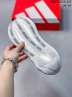 View of the textured outsole with elongated traction sections and a central patterned area.