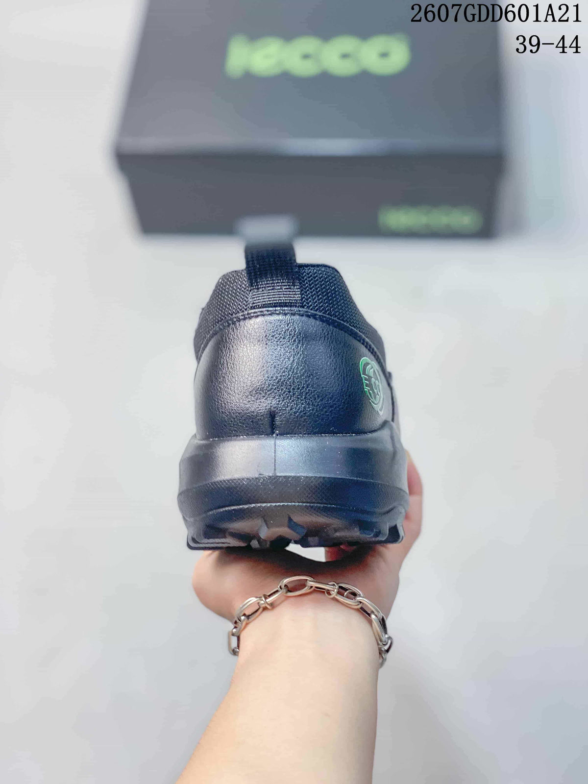 Rear view of the black sneaker showing the heel pull tab, padded heel panel, and textured outsole.