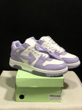 Lavender and white low-top sneakers displayed on a green shoebox, showing the front and side panels.