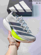 Light gray adidas Adizero Prime X3 shoe with dark stripes and a neon yellow sole accent.