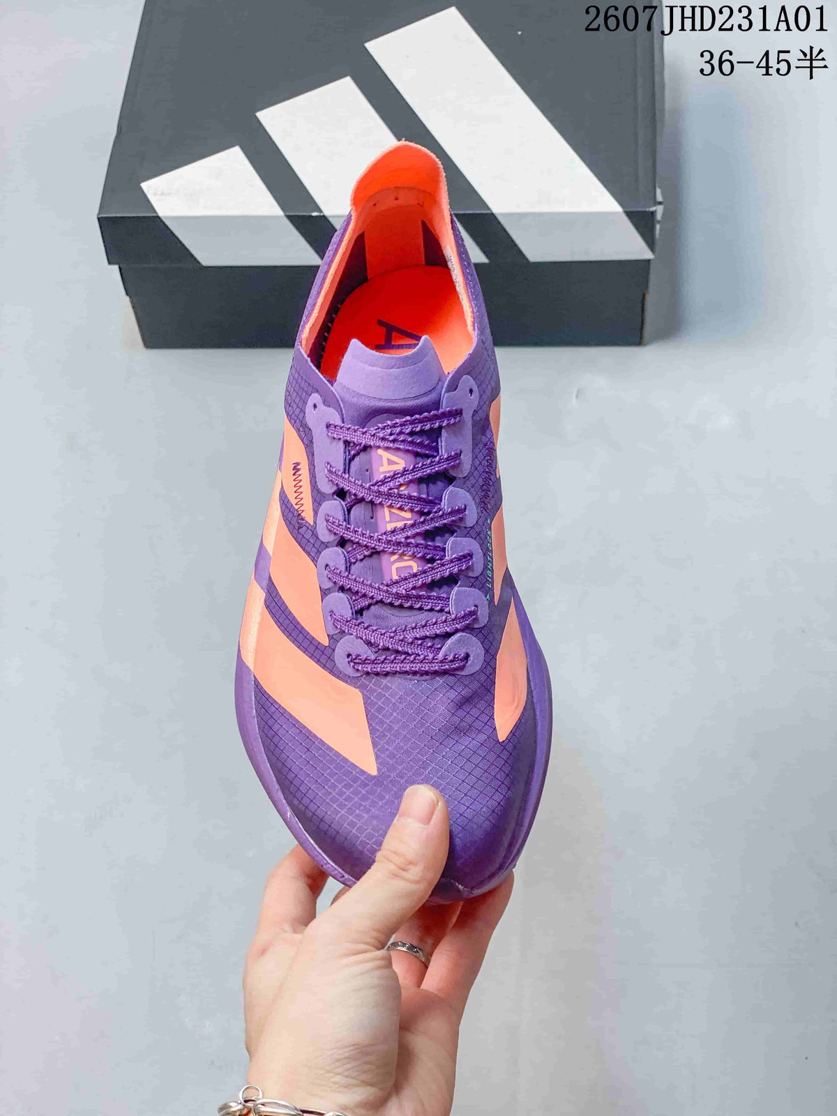 Top view of the purple and coral lace-up running shoe