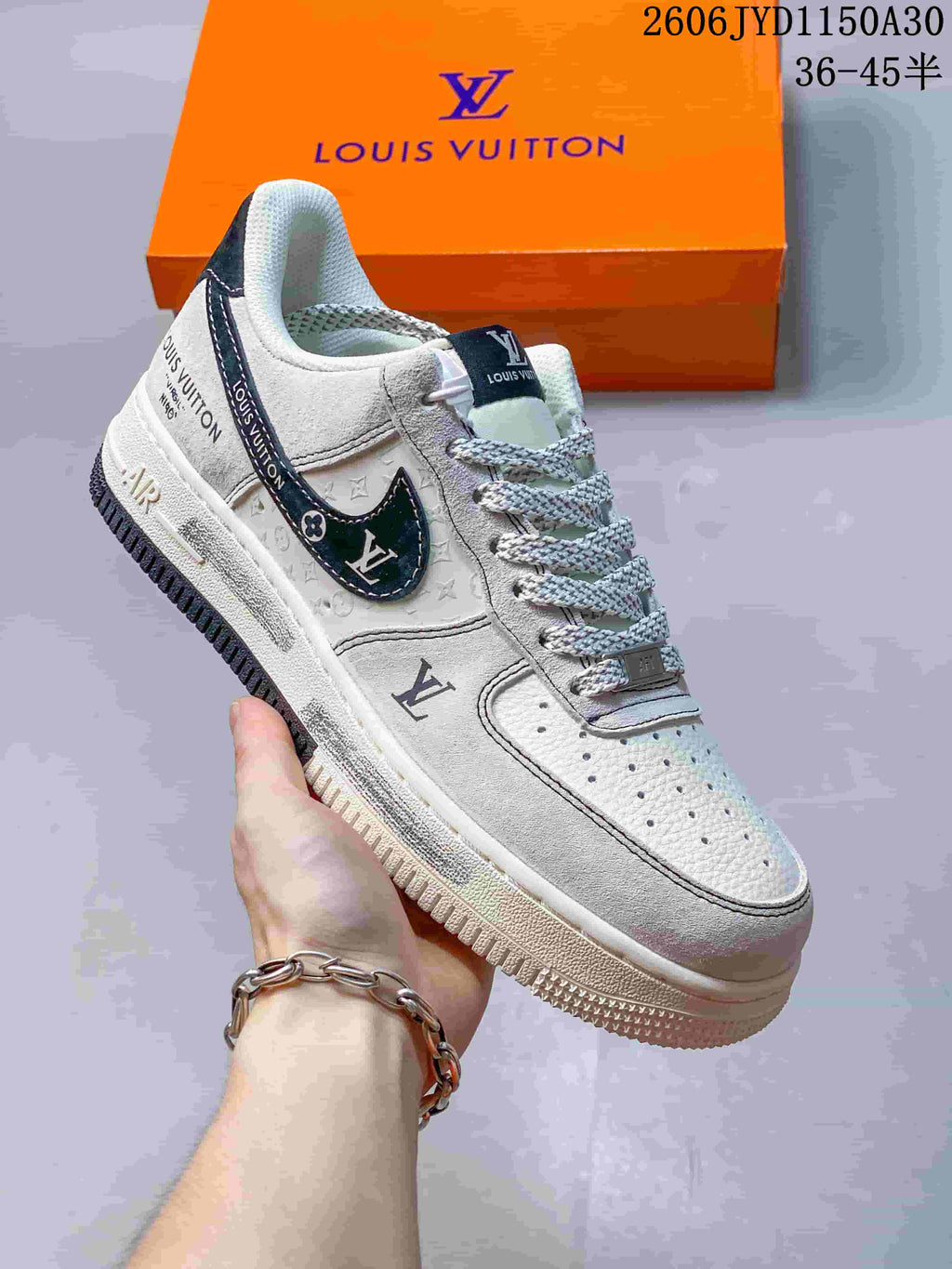 Angled view of the sneaker with dark side accents and monogram-style details