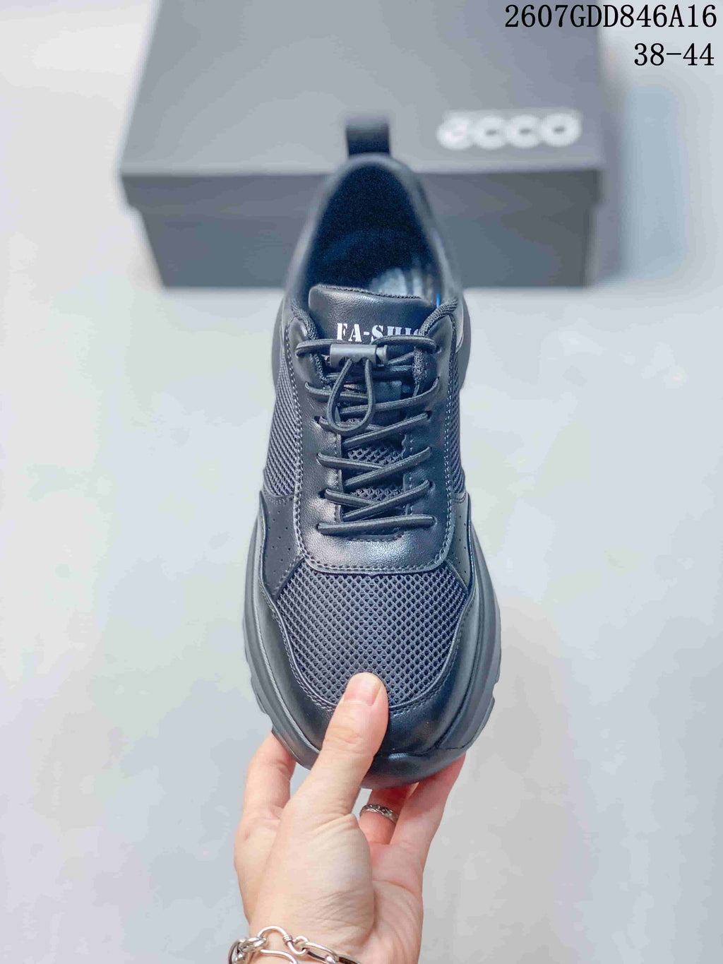Top view of the sneaker showing the rounded toe, textured mesh vamp, lace arrangement, and padded tongue.