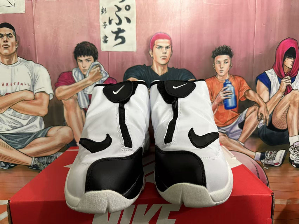 Front view of white and black Nike The Glove shoes showing the zip-up shrouds and Swoosh details