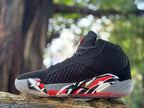Side profile showing the patterned upper and graphic midsole of a Jordan XXXVIII shoe