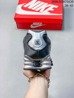 Rear view of a Nike Shox TL sneaker with a silver heel detail