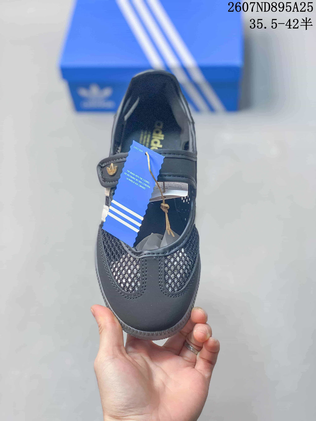 Top view showing the rounded toe, mesh panels, adjustable strap, and adidas insole branding.