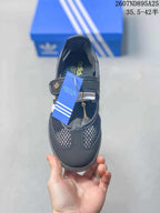 Top view showing the rounded toe, mesh panels, adjustable strap, and adidas insole branding.