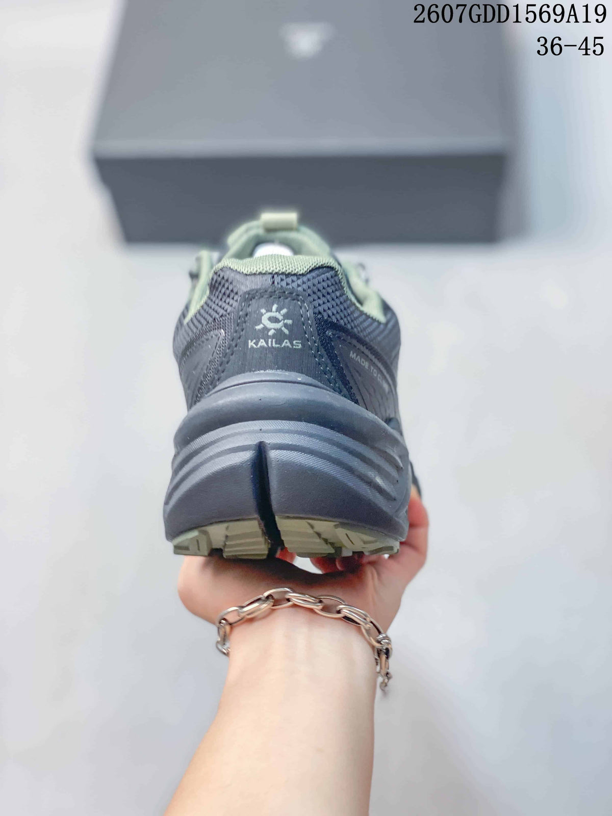 Rear view showing the KAILAS heel logo, padded collar, and layered outsole design.