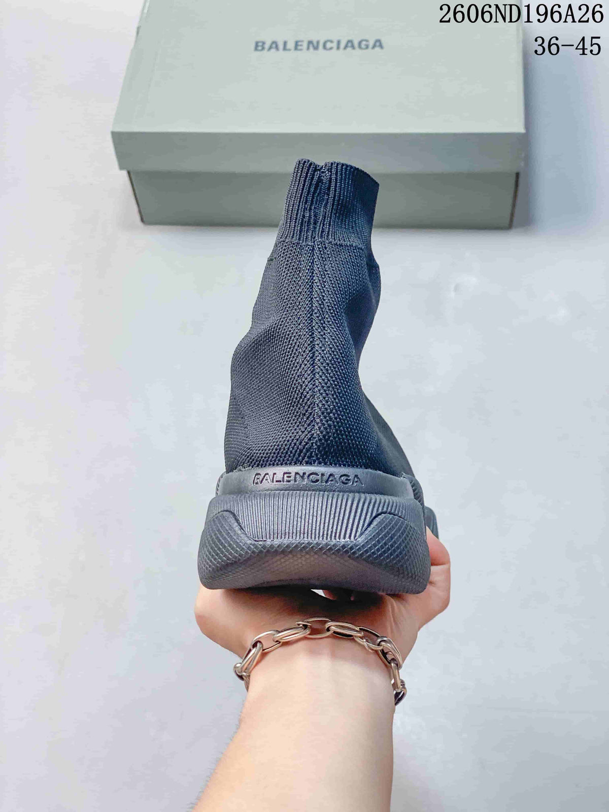 Rear view of the dark gray sock sneaker showing the knit ankle collar, heel branding, and sculpted heel section.