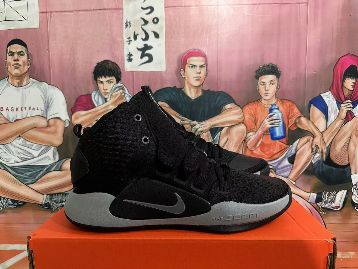 Side view of a black Nike Hyperdunk basketball shoe with grey midsole and Swoosh
