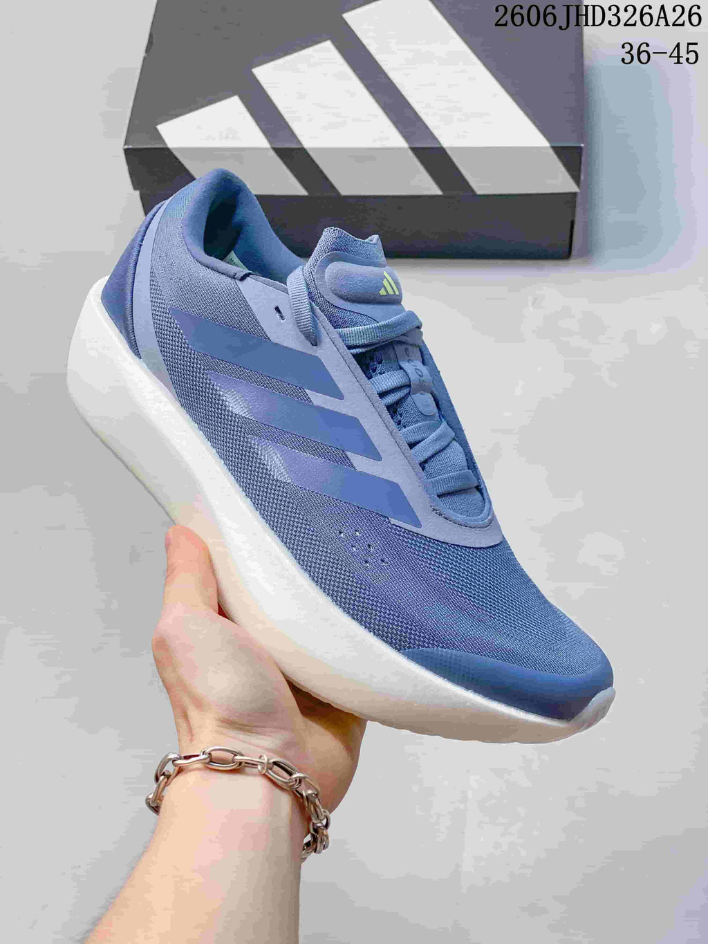 Angled side view showing the blue upper, three-stripe details, and white sole