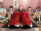 Front view of red Nike sneakers with laces and light-colored side panels