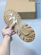 Underside of the sneaker showing a tan patterned outsole with raised traction sections and Louis Vuitton branding.