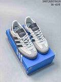 Pair of white, black, and gray low-top Adidas sneakers displayed on a blue shoebox; overlay text shows 36–45 sizing.