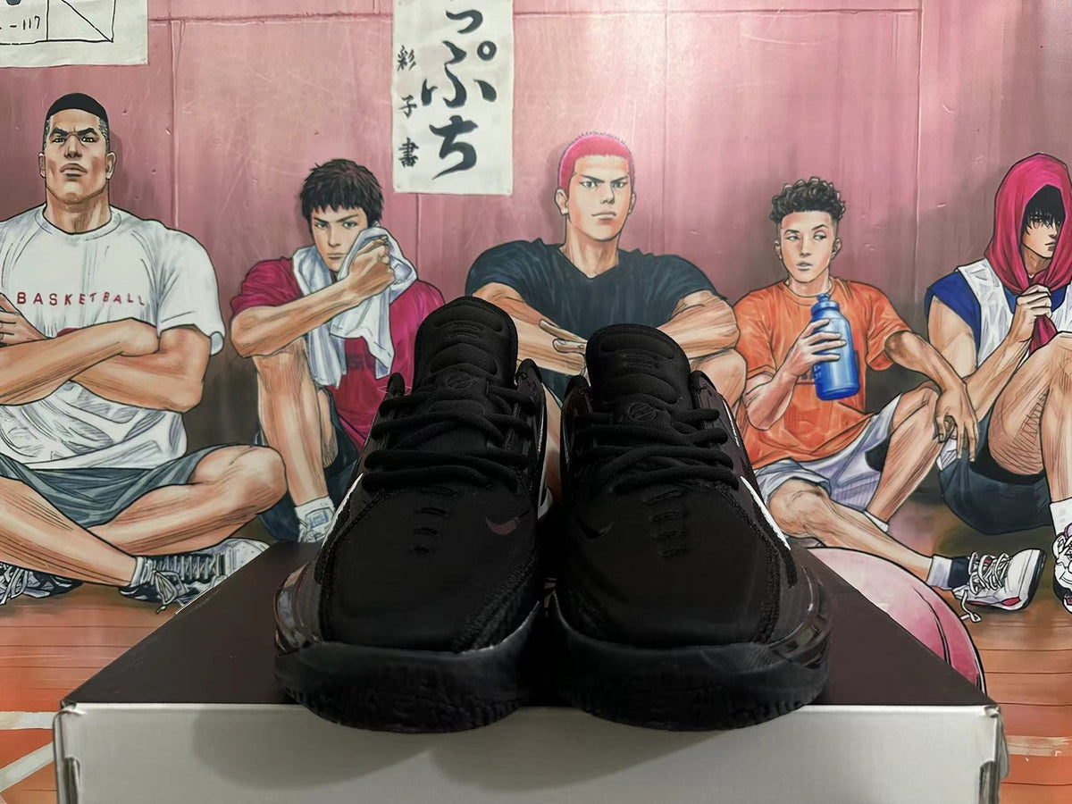 Front view of black lace-up basketball shoes