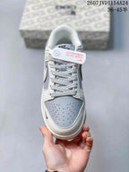 Top-down view showing the perforated grey toe panel, patterned laces and contrasting overlays.