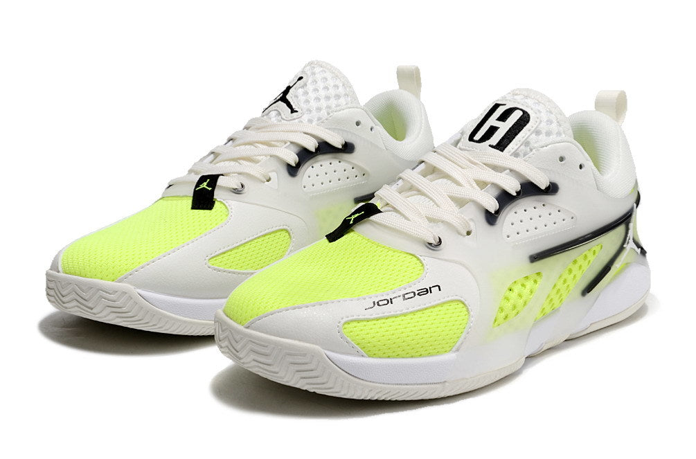 Pair of white and fluorescent lime Jordan Heir shoes, viewed from the front