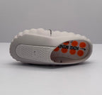Top and side view of one slide sandal showing the perforated strap, pink footbed, and Nike markings.