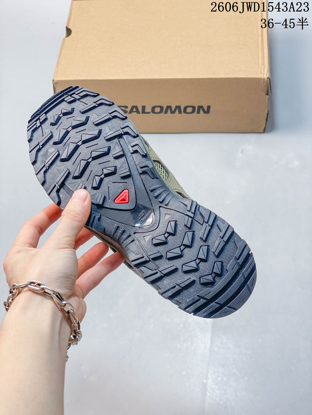 Close-up of the Salomon shoe outsole showing its lugged tread pattern
