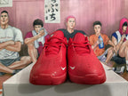 Front view of red basketball shoes showing perforated toes and lace-up closure