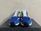 Front view of blue and yellow New Balance U370 sneakers with white laces